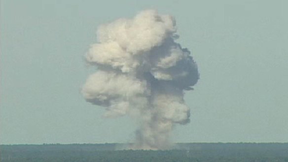A rising mushroom cloud from a MOAB, from an Air Force video.
