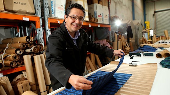 Simon Zdraweski of Specialty Pleaters with the pressing machine he uses for his work in the fashion industry.