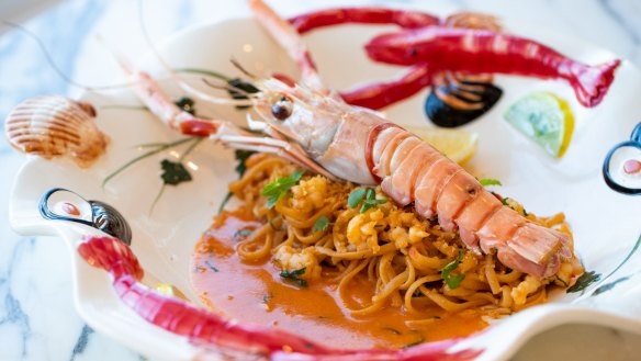 Scampi linguine served on an ornamental platter. 