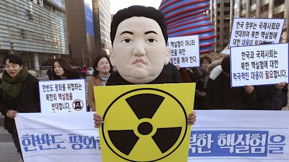 A South Korean university student wears a mask depicting North Korean dictator Kim Jong-un, after the North Korean regime claimed it had tested a hydrogen bomb.