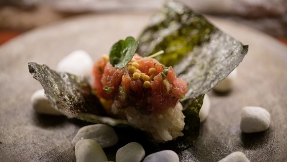 Gaku tuna handroll with tuna tartare and shallots.