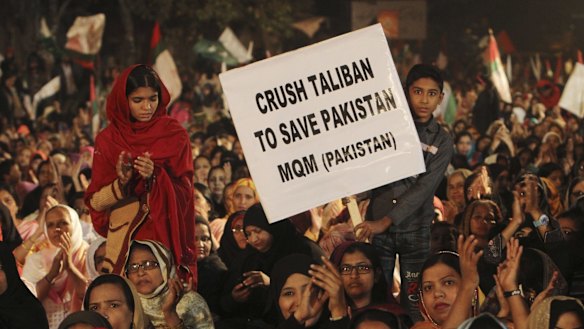 Supporters of Pakistan's MQM political party call for harsh measures against the Taliban at a rally in Karachi on Friday.