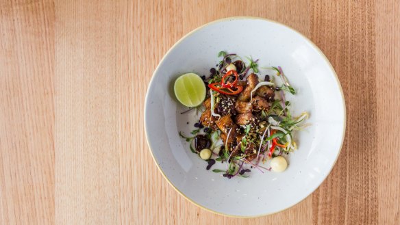 The sticky fried pork belly entree is dished up as a simple Asian-style salad