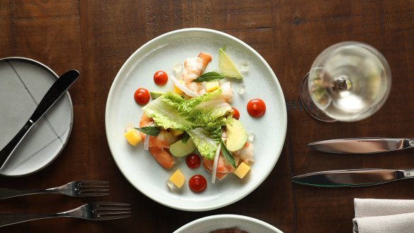 Ballina king prawns, roasted capsicum, chilli dressing, mango, avocado, fresh coconut, coconut jelly, baby cos lettuce and muoccham dressing.