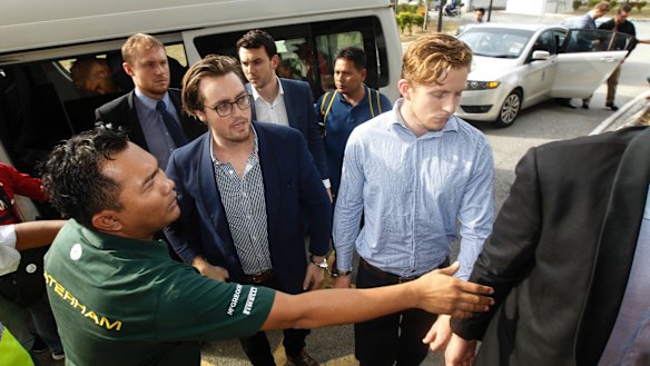 Nick Kelly, centre left, and Thomas Whitworth, centre right, arrive at court on Thursday. 