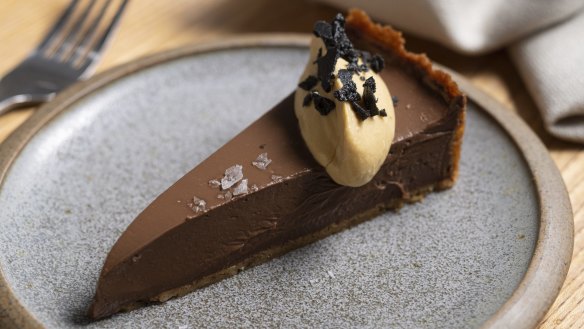 Chocolate tart garnished with crispy duck skin.