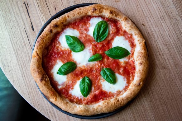 Tomato, buffalo mozzarella and basil pizza. 