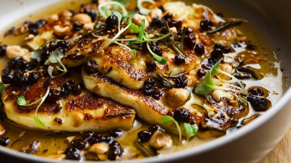 Grilled halloumi with honey, hazelnuts and currants.