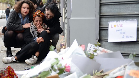 A woman cries near Le Petit Cambodge restaurant in Paris after the deadly attacks. But how much will this latest atrocity turn public opinion? 