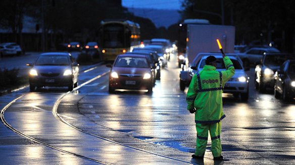 Police direct traffic around the CBD in Adelaide on Wednesday afternoon.