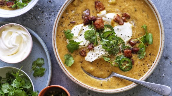 Roasting the potatoes skin-on helps achieve a silky-smooth result. Serve the soup with sour cream, fresh jalapenos and coriander.