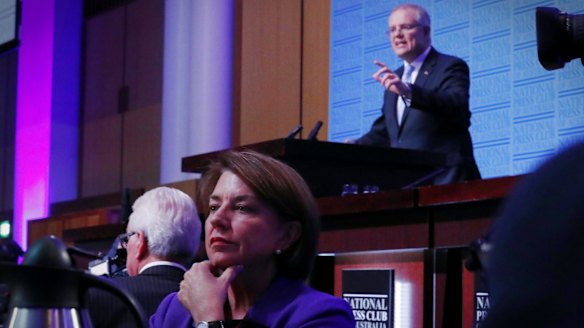 Banking chief Anna Bligh listens as Treasurer Scott Morrison delivers his post-budget address.