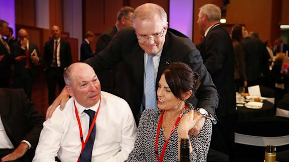 Treasurer Scott Morrison with his brother-in-law Garry Warren and his wife Michelle Warren.