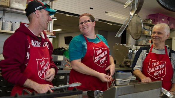 Sean Smith (wearing hat), Patricia Young and Keith Fernandez, working for the dole at the Salvation Army in Auburn, Sydney.