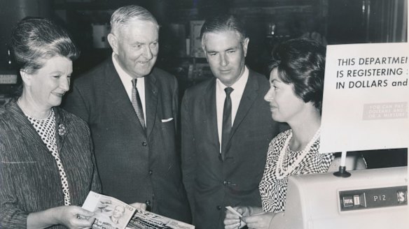 A smooth transition: Miss N. Malseed (in charge of decimal training at Myer), Sir Walter Scott, Mr L. B. Brand and Mrs J. Smith, Myer staff member. 