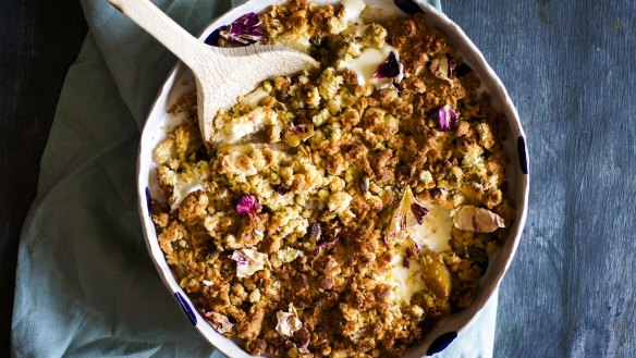 Pear crumble with pools of melted white chocolate.