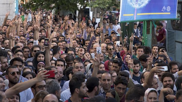 TEHRAN, IRAN - MAY 19: Voters gather outside a polling station in Tehran.