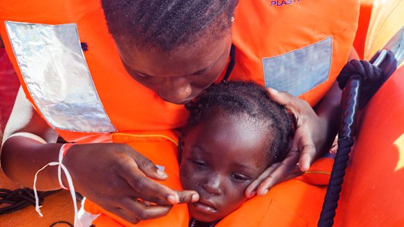 Sara Traore, a two-year old girl from Ivory Coast, is rescued from a rubber boat sailing out of control about 24 kilometres north of Al Khums, Libya.