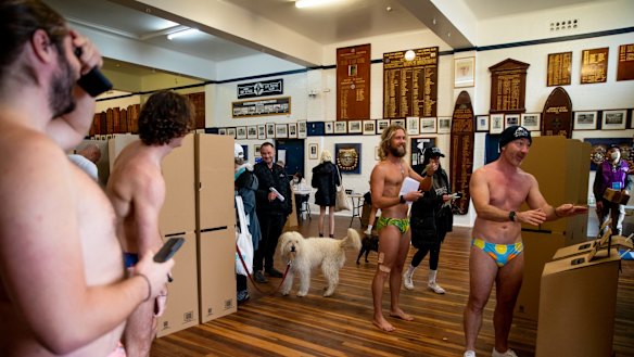Dogs watch their owners cast their votes at Bondi Beach in Sydney.