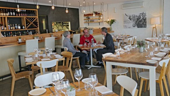 The East Bar and Dining interior has a modern beachy theme.