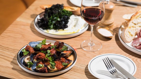 Mussels with cured pork sausage and tomato (left).