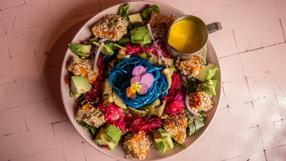 The rainbow salad is a simple salad under a superfood strata. 