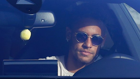 Brazil striker Neymar arrives at Barcelona's training grounds on Wednesday.