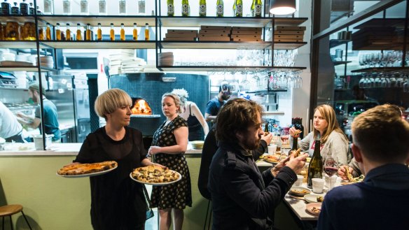 Prepare to queue for a table at Pizza Madre.