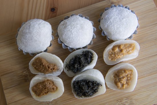 A set of mixed mochi, round and spongy rice desserts.