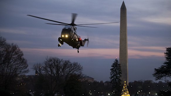 Marine One, carrying US President Donald Trump, prepares to land on the South Lawn.