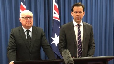 Former federal resources minister Matt Canavan (right) announces he has quit cabinet amid doubts about his citizenship on Tuesday.