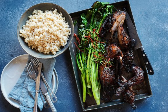 Twice-cooked sticky duck with charred Asian greens.