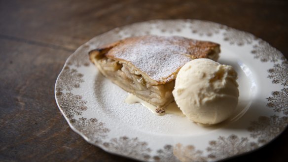 A wedge of Ben's apple pie with vanilla ice-cream.