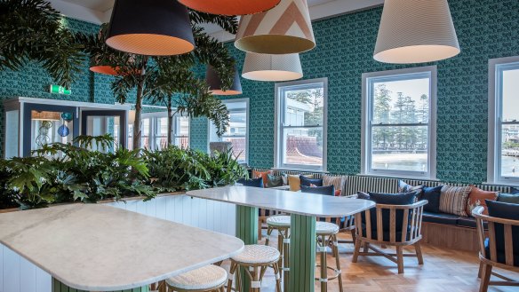 The new Manly Pavilioun features patterned green wallpaper, indoor plants and a fresh coastal look.