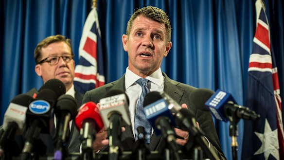 Mike Baird and Deputy Premier Troy Grant announce the greyhound racing reprieve on Tuesday.