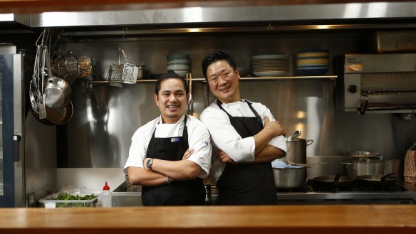 Chef Binh Pham (left) and chef-owner Calvin Cho, who have worked together for 14 years, at Charles Street Kitchen.