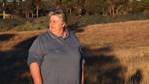 Bywong resident Denise Hudson is unhappy about the glass near the Federal Highway