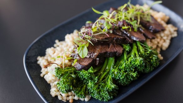 Angus beef cheeks, braised for 12 hours, pearls of cous cous, and broccolini. 