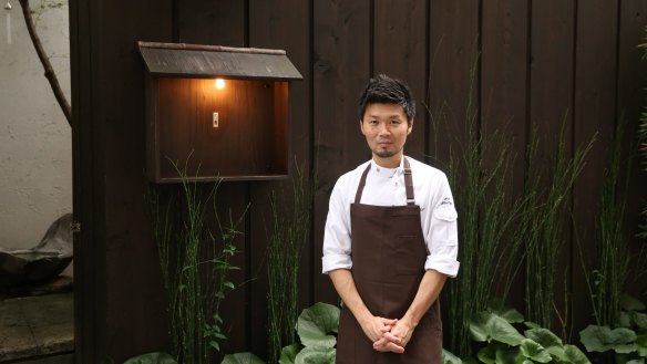 Zaiyu Hasegawa outside his Michelin-starred restaurant, Den.