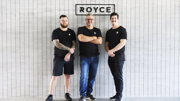 Ross Dobson (centre) at Cafe Royce with barista Anthony Brownlie (left) and waiter Ollie Masters (right).