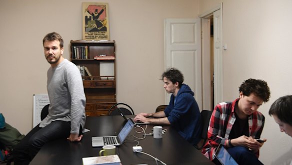 The journalist Mikhail Zygar, left, with staff on Project 1917 in Moscow.