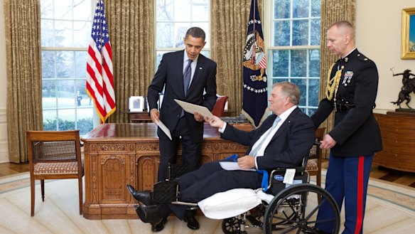 President Barack Obama exchanges credentials with Kim Beazley, the incoming ambassador from Australia, in the Oval Office in 2010.