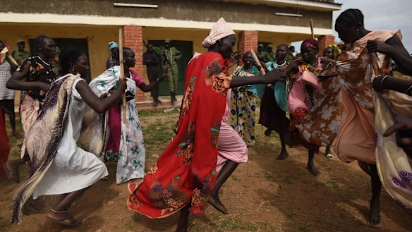 Rival camps: Women supporters of South Sudan's opposition dance on the outskirts of the capital Juba after opposition military chief Simon Gatwech Dual's arrived in the city in April 2016. 