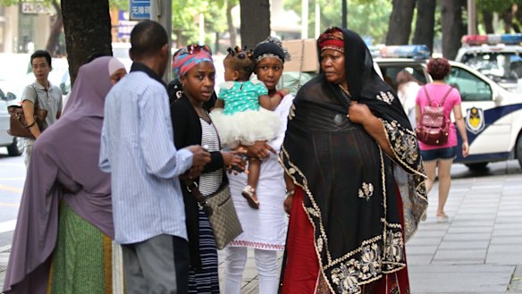 Ibrahim Jalloh's relatives at Guangzhou People's Intermediate Court, in Guangdong on Friday. 