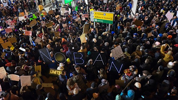 Protesters assemble at John F. Kennedy International Airport in New York after  two Iraqi refugees were detained while trying to enter the country. 