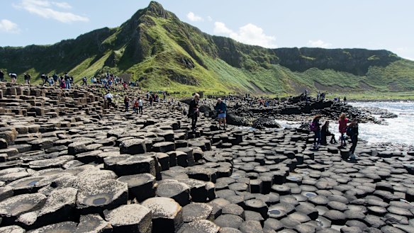 Bushmills: crowd of tourists to see Giant's Causeway.