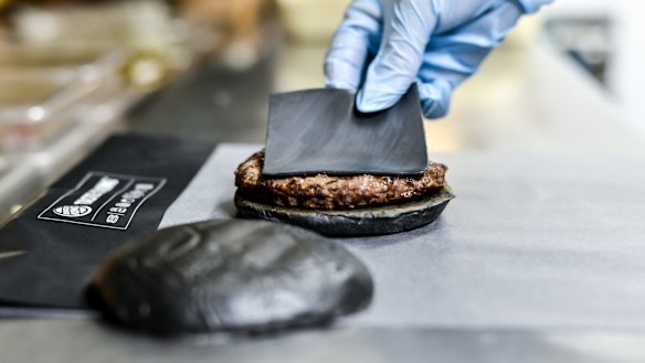 The Kuro Pearl black buns and cheese smoked with bamboo charcoal and black sauce made of squid ink. 