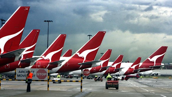 Qantas banned a passenger who asked to be removed from a flight because an asylum seeker was on board.