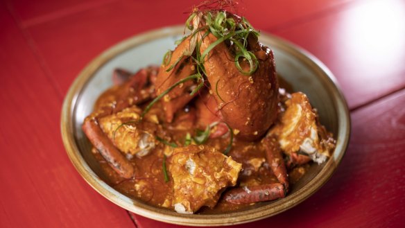 The chilli crab is cooked over high heat until the flesh is velvety, with broken shells for easier eating and saucing.