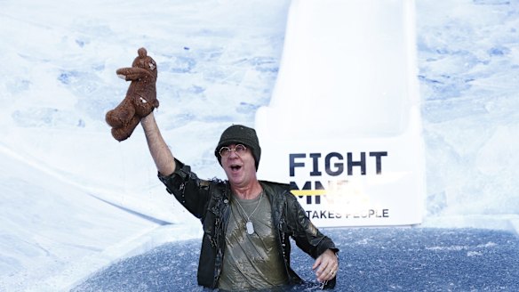 Andy Maher, Radio and TV personality, goes down the slide for Big FightMND Freeze 8 as Radar from MASH. 